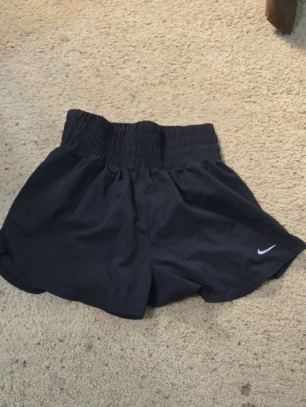 Nike Black High-Waist Smocked Athletic Shorts with White Swoosh